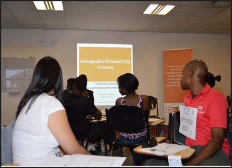 Participants listing to a presentation by UNFPA